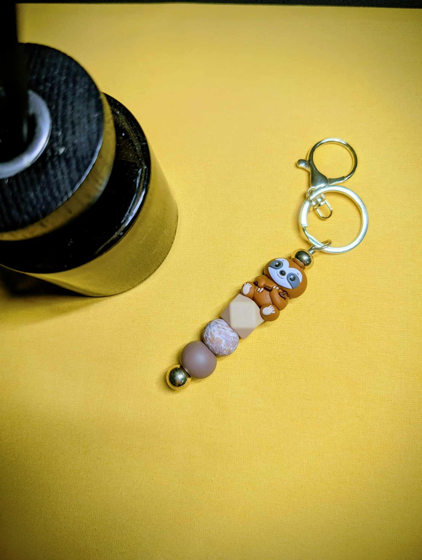 Porte-clés  doré PARESSEUX